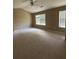 Spacious bedroom with carpet, vaulted ceiling, and two windows providing natural light at 1466 Dolcetto Nw Trce # 18, Kennesaw, GA 30152