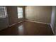 Versatile room with hardwood flooring, door to the exterior, and a window at 1466 Dolcetto Nw Trce # 18, Kennesaw, GA 30152