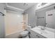 Bathroom features a tub-shower combo, white vanity, and gray walls at 1642 Ashmar Sw Ln, Marietta, GA 30064