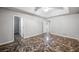 Spacious bedroom features a tray ceiling, ceiling fan, natural light, and a view to the en suite at 1642 Ashmar Sw Ln, Marietta, GA 30064