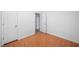 Cozy bedroom with tile floors, two closets, and a doorway leading to another room at 1642 Ashmar Sw Ln, Marietta, GA 30064