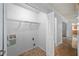 Laundry room with open doorway, metal shelving, and connections for a washer and dryer at 1642 Ashmar Sw Ln, Marietta, GA 30064