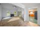 Bright living room with fireplace, and entryway to kitchen with tile flooring at 1642 Ashmar Sw Ln, Marietta, GA 30064