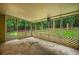 Screened porch offering views of the backyard and lush green trees at 1642 Ashmar Sw Ln, Marietta, GA 30064