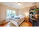Cozy bedroom with hardwood floors, natural light, and a comfortable bed at 1761 Flat Shoals Se Rd, Atlanta, GA 30316
