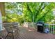 Enjoy outdoor living on this spacious deck, featuring seating and a grill for entertaining at 1761 Flat Shoals Se Rd, Atlanta, GA 30316