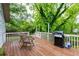Inviting wood deck with outdoor seating and a grill, perfect for entertaining at 1761 Flat Shoals Se Rd, Atlanta, GA 30316