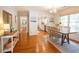 Open-concept dining room connects to the kitchen and boasts hardwood flooring at 1761 Flat Shoals Se Rd, Atlanta, GA 30316