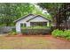 Charming bungalow featuring manicured landscaping and a welcoming front porch at 1761 Flat Shoals Se Rd, Atlanta, GA 30316