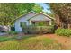Charming craftsman home with stone facade, covered porch, mature landscaping, and a well-manicured lawn at 1761 Flat Shoals Se Rd, Atlanta, GA 30316