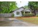 Home featuring a well-maintained lawn, mature trees and a charming front porch at 1761 Flat Shoals Se Rd, Atlanta, GA 30316