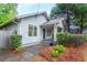 Side view of cozy home with lush landscaping and inviting front porch at 1761 Flat Shoals Se Rd, Atlanta, GA 30316