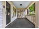 Inviting covered porch with classic columns and ample space for outdoor seating at 1761 Flat Shoals Se Rd, Atlanta, GA 30316