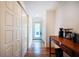 Bright hallway with multiple closets and dark stained wood flooring at 1761 Flat Shoals Se Rd, Atlanta, GA 30316