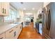 Modern kitchen design with stainless steel appliances, white cabinets, and marble countertops at 1761 Flat Shoals Se Rd, Atlanta, GA 30316