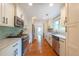 The kitchen features white cabinets, stainless appliances, and tiled backsplash at 1761 Flat Shoals Se Rd, Atlanta, GA 30316