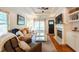 Open-concept living space with fireplace, hardwood floors and tray ceiling at 1761 Flat Shoals Se Rd, Atlanta, GA 30316