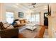 Comfortable living room with fireplace, hardwood floors, and ample natural light at 1761 Flat Shoals Se Rd, Atlanta, GA 30316