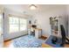Bright office with natural light, hardwood floors, and calming blue walls at 1761 Flat Shoals Se Rd, Atlanta, GA 30316