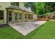 Outdoor living space features a large patio, well-maintained lawn, and beautiful landscaping at 2437 Camden Lake Nw Vw, Acworth, GA 30101