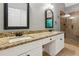 Bathroom featuring double sinks, granite countertops, and a walk-in shower at 2437 Camden Lake Nw Vw, Acworth, GA 30101