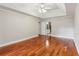 Spacious bedroom features hardwood floors, a tray ceiling, and access to the bathroom at 2437 Camden Lake Nw Vw, Acworth, GA 30101