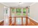 Dining room with hardwood floors and windows with wooded backyard views at 2437 Camden Lake Nw Vw, Acworth, GA 30101