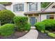 Charming home featuring lush landscaping, a stone walkway, and a welcoming front entrance at 2437 Camden Lake Nw Vw, Acworth, GA 30101