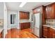 Well-appointed kitchen with stainless steel refrigerator, granite countertops, and wooden cabinets at 2437 Camden Lake Nw Vw, Acworth, GA 30101