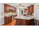 Well-equipped kitchen with stainless appliances, granite countertops, and cherry wood cabinetry at 2437 Camden Lake Nw Vw, Acworth, GA 30101