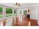 Open-concept living room with hardwood floors and seamless access to the kitchen at 2437 Camden Lake Nw Vw, Acworth, GA 30101