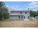 View of the rear exterior showcasing the yard and siding at 458 Ajo Way, Dallas, GA 30157