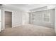 Bright bedroom featuring neutral walls, carpeted floors, and walk-in closet at 458 Ajo Way, Dallas, GA 30157