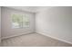 Bright bedroom with a large window offering a view of the surrounding greenery at 458 Ajo Way, Dallas, GA 30157