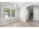 Dining area with wood floors, large windows, and modern chandelier at 458 Ajo Way, Dallas, GA 30157