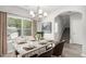 Dining room with modern chandelier and natural light and view of stairs at 458 Ajo Way, Dallas, GA 30157