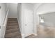 View of the home's entryway and carpeted stairs leading to the second floor at 458 Ajo Way, Dallas, GA 30157