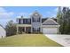 Charming two-story home with gray siding, black shutters, and a well-manicured front lawn at 458 Ajo Way, Dallas, GA 30157