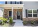 Inviting front entrance featuring stone accents, a dark-colored front door, and decorative landscaping at 458 Ajo Way, Dallas, GA 30157