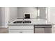Modern kitchen island with a granite countertop, sink, and stainless steel dishwasher at 458 Ajo Way, Dallas, GA 30157
