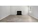 Bright living room featuring stylish wood floors and a cozy fireplace at 458 Ajo Way, Dallas, GA 30157