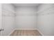Walk-in closet featuring carpeted floors and shelving at 458 Ajo Way, Dallas, GA 30157
