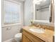 Cozy bathroom with granite countertops, modern faucet, and window for natural light at 1100 Faith Se Ave, Atlanta, GA 30316
