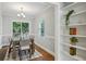 Bright dining room featuring a wood table, stylish chairs, and a sliding glass door to the outdoor deck at 1100 Faith Se Ave, Atlanta, GA 30316