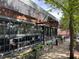 Modern building with large windows, sidewalk seating, and greenery along the facade at 1100 Faith Se Ave, Atlanta, GA 30316