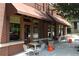 Brick building with stylish awnings, ample window space, and cozy outdoor seating area at 1100 Faith Se Ave, Atlanta, GA 30316