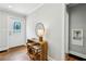 Inviting foyer with hardwood floors, decorative door, stylish console table, and neutral wall color at 1100 Faith Se Ave, Atlanta, GA 30316