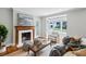 Cozy living room with hardwood floors, a fireplace, stylish furnishings, and bright natural light at 1100 Faith Se Ave, Atlanta, GA 30316