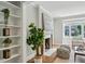 Cozy living room featuring a fireplace, built-in bookshelves, and large windows offering natural light at 1100 Faith Se Ave, Atlanta, GA 30316
