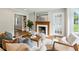 Inviting living room featuring hardwood floors, fireplace, comfortable seating, and French door at 1100 Faith Se Ave, Atlanta, GA 30316
